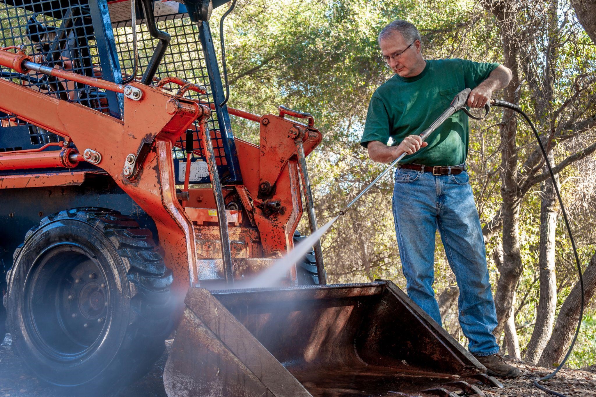 man cleaning the equipment